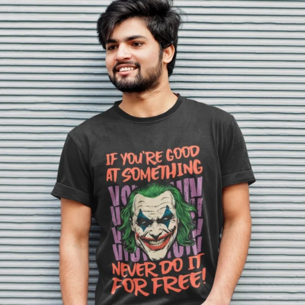 An Indian male wearing Oakham's t-shirt which says "If you're good at something, never do it for free".